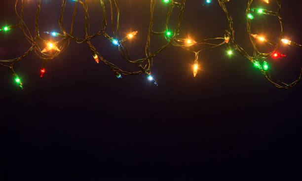 istock Christmas lights on blue background with copy space 1181502827