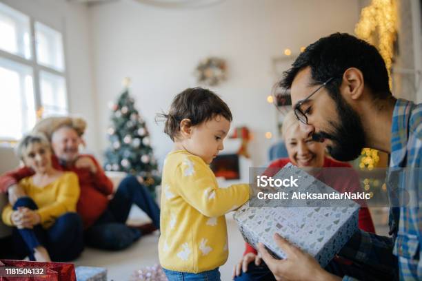 Opening Christmas Presents Stock Photo - Download Image Now - Christmas, Family, Christmas Present