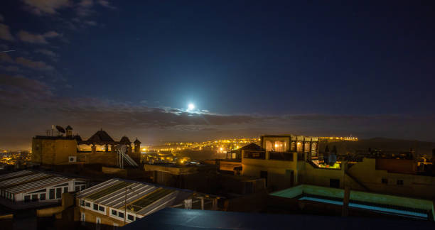 istock night view  on FEZ   and  moon in the sky 1181506231
