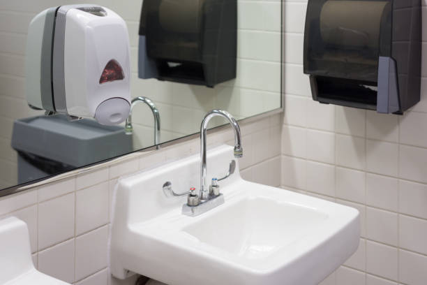 istock White porcelain sink in public restroom 1181507248