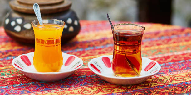 istock Turkish orange and black tea in traditional glasses 1181508105