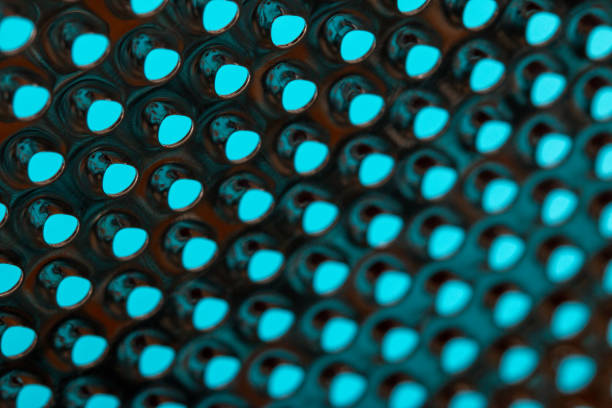 istock metal surface with holes on a grater 1181508135