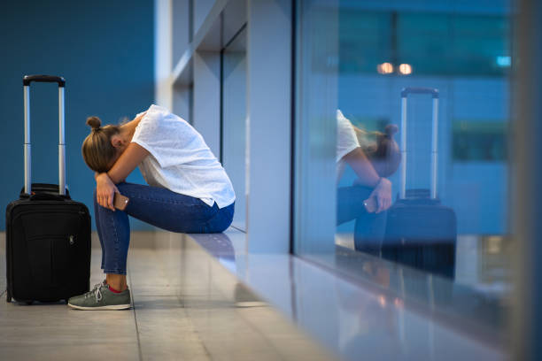 istock Exhausted female passenger waiting for her re-scheduled/delayed flight 1181508334