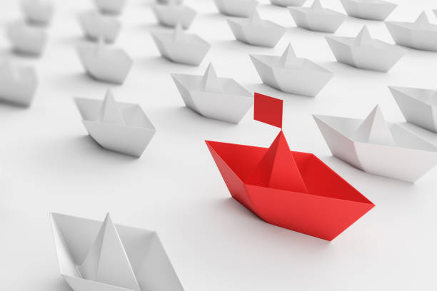 istock Business leadership, white and red paper ships 1181512300
