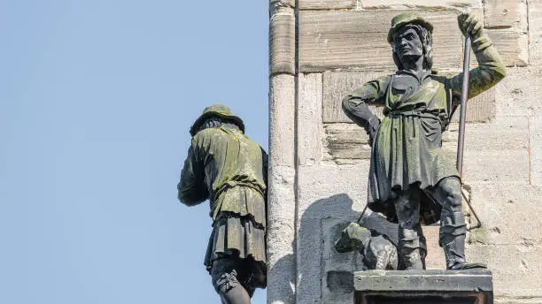 Photo of Wall statue of middle age shepherd with a dog at Magdeburg Cathedral, Magdeburg, Germany