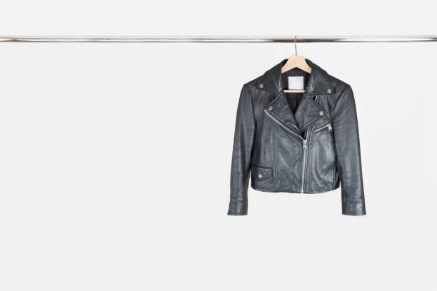 fashion leather jacket hanging on hanger on white background - casaco de couro imagens e fotografias de stock