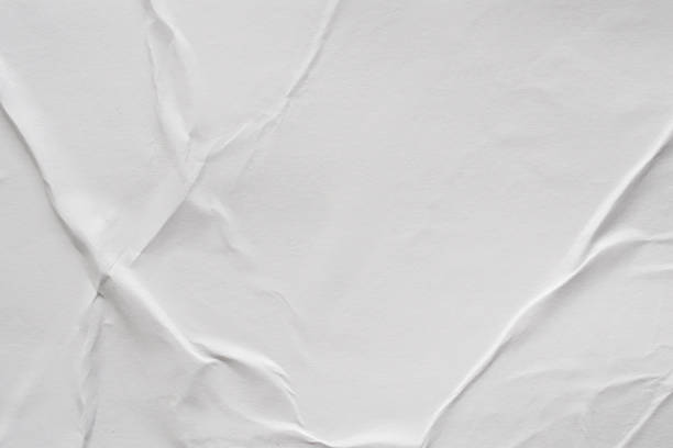 istock Blank white crumpled and creased paper poster texture background 1181522399