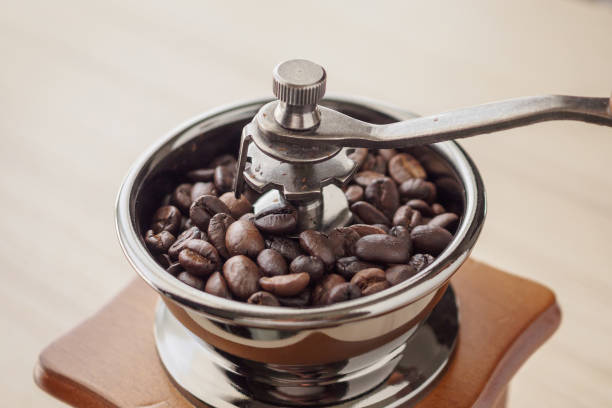 istock Vintage manual coffee grinder with roasted coffee beans 1181524210
