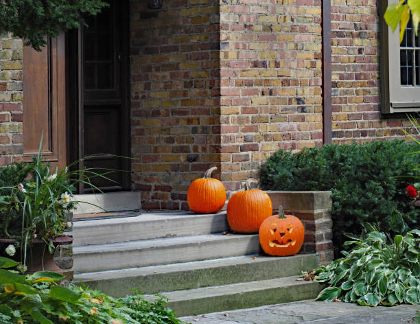 istock Front steps of house with pumpkins for Halloween 1181525752