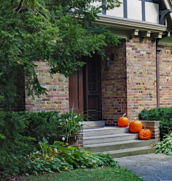 istock Front steps of house with pumpkins for Halloween 1181525753