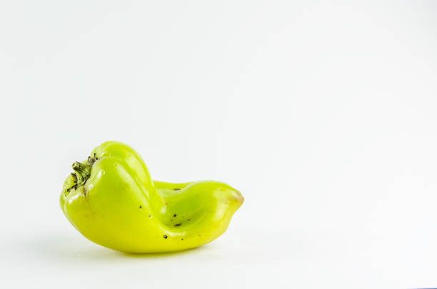 ugly food. green pepper on a white background. copy space