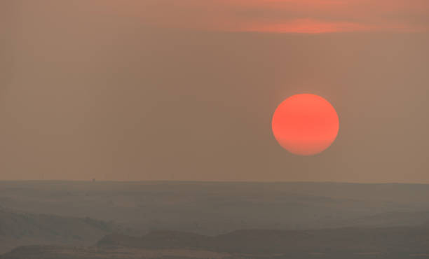 istock Close Up Burning Sun on the Horizon Before Sunset 1181531668