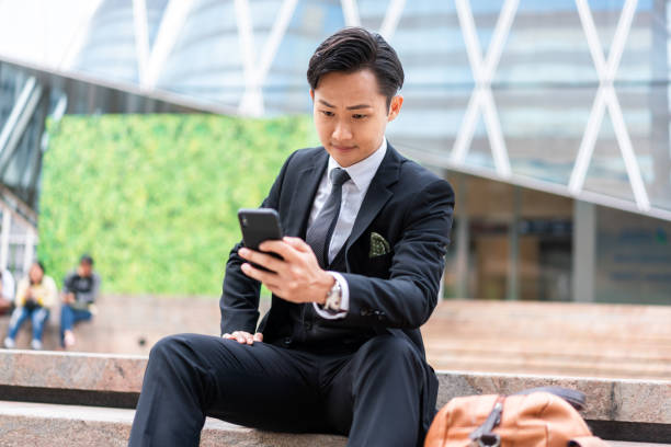 istock Asian businessman using his smartphone 1181536268