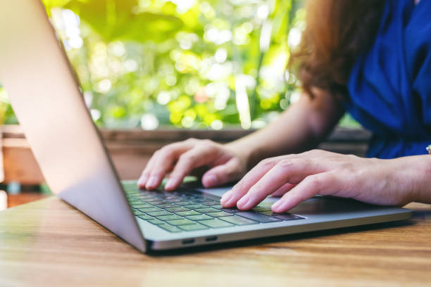 istock a woman working and typing on laptop computer on the table 1181536730