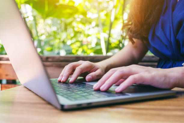 istock a woman working and typing on laptop computer on the table 1181536745