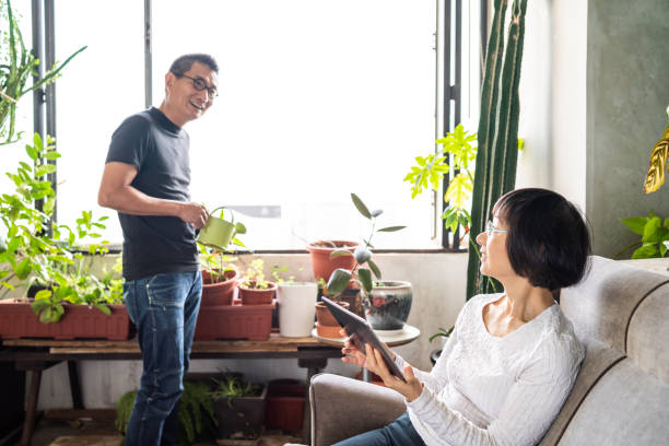istock Chinese couple talking in a conservatory 1181538306