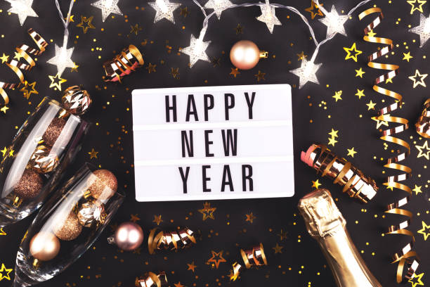 istock New Year composition with confetti, decorations and champagne. 1181538573