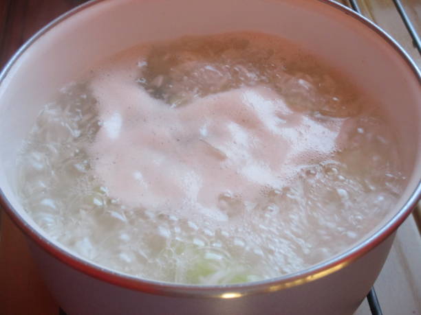 istock Rice cooked in water   Rice being cooked in a pan 1181541229