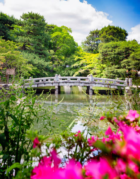 istock Stone bridge over pond in Japanese garden 1181545562