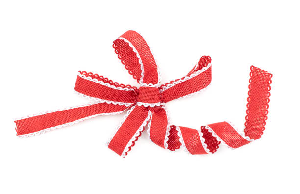 istock Red ribbon bow with white border isolated on white 1181550510