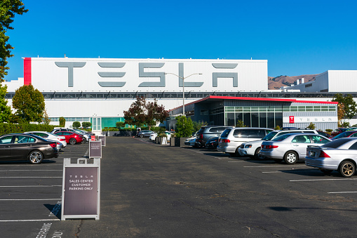Fremont, CA, USA - 2019 : Tesla showroom and sales center outdoor parking lot at the Tesla Factory, automobile manufacturing plant in Silicon Valley