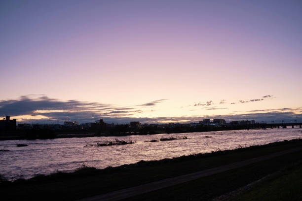 istock Tama River over a typhoon at sunset 1181552418