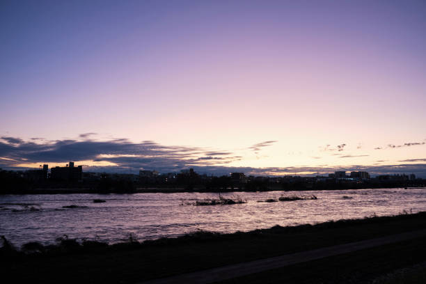 istock Tama River over a typhoon at sunset 1181552447
