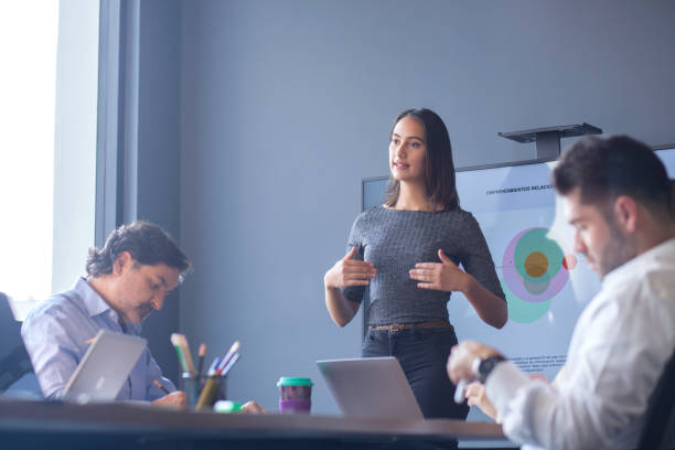 istock Woman conducting a conference in the boardroom 1181553385