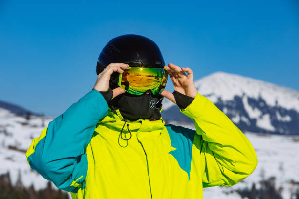 istock man in helmet and ski mask. reflection. winter activity. sunny day 1181556760