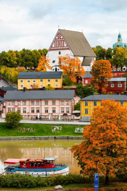 view of old porvoo, finland. beautiful city autumn landscape with porvoo cathedral and colorful wooden buildings. - medieval autumn cathedral vertical imagens e fotografias de stock