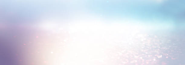 istock abstract glitter silver, gold , blue lights background. de-focused. banner 1181559542