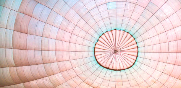 istock Hot air balloon's dome inside while it filling with air. Soft pastel colors. 1181561726