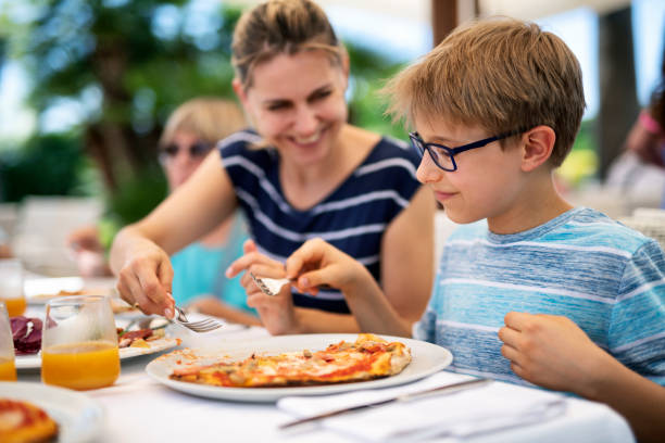 istock Family enjoying pizza lunch 1181566234