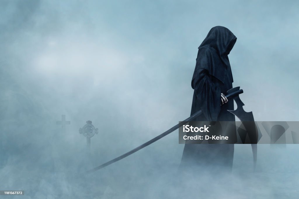 Grim Reaper Grim Reaper walking in fog. Halloween. Grim Reaper Stock Photo
