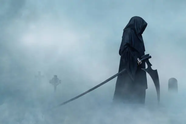 Grim Reaper walking in fog. Halloween.