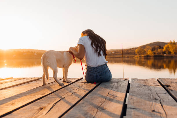 istock Young Pretty Woman with Her Dog 1181567405