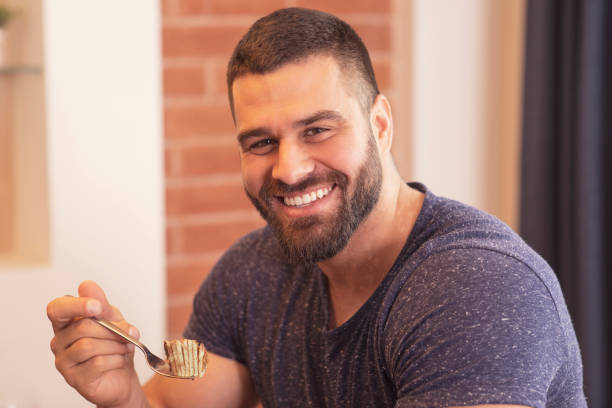 istock Young men  Enjoying in cake dessert 1181568643