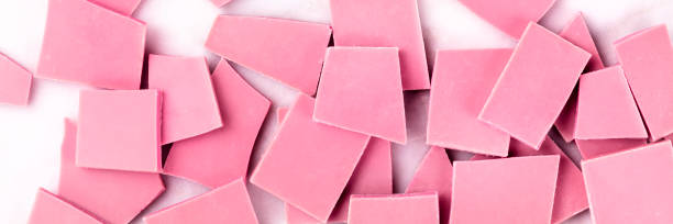 istock A panorama of ruby chocolate, overhead shot on a white marble background 1181568983