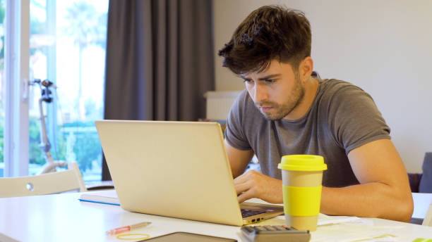 istock Young man working at home 1181569392