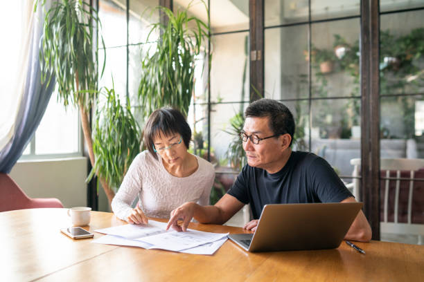 istock Mature couple working in a design studio 1181570164