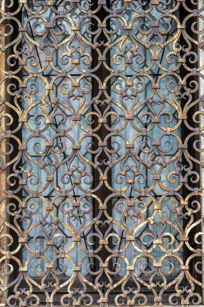 Venice, detail of an ancient window with grating in wrought iron, UNESCO world heritage site, Veneto, Italy, Europe