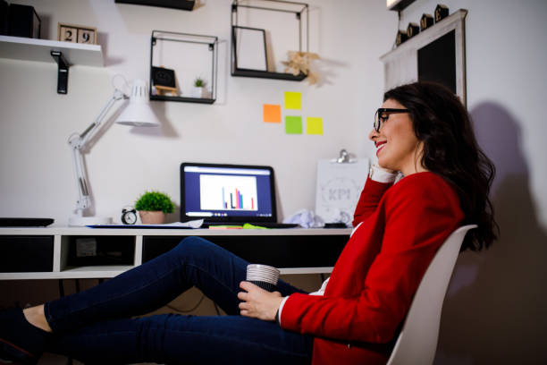 istock Young freelance working on laptop in home office 1181584295
