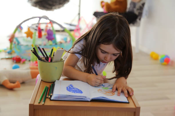 istock The girl writes 1181584530
