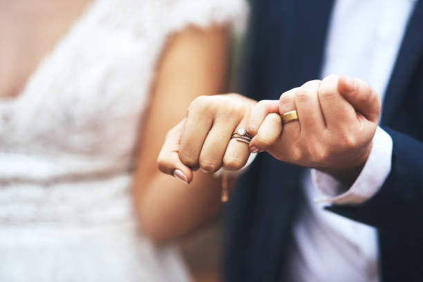 I pinky promise I'll be by your side forever Cropped shot of an unrecognizable newlywed couple doing a pinky swear gesture on their wedding day wedding ceremony stock pictures, royalty-free photos & images