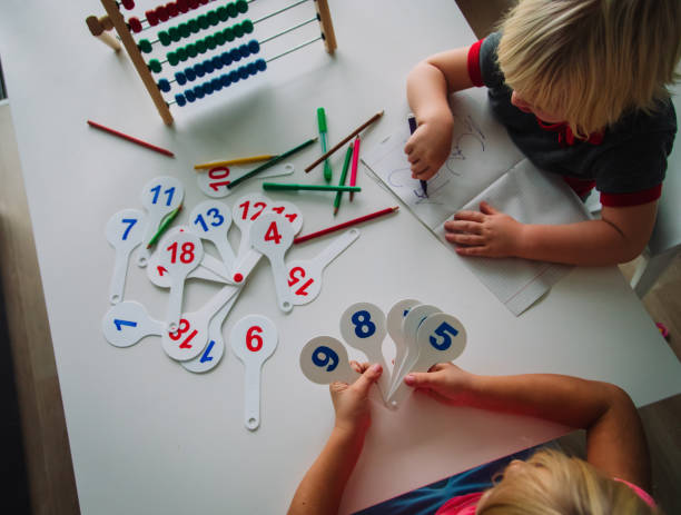 istock kids calculate and learn numbers, children study math 1181588765