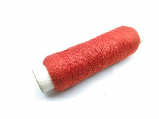istock A picture of red thread roll isolated on white background 1181591827