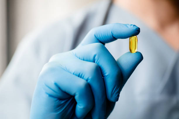 yellow capsule, pill, medicine, stock photo
