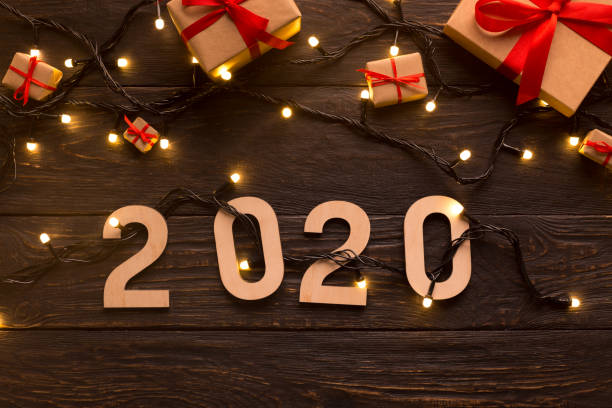 istock New year present boxes and garland with 2020 concept 1181594350