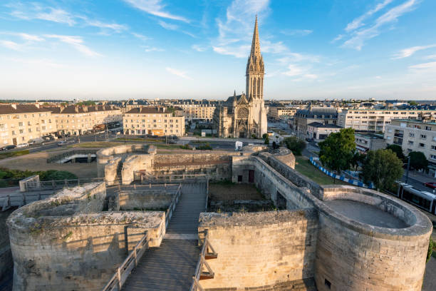 Caen, Castle and church Views of the church of San Pedro and the Castle of Caen caen photos stock pictures, royalty-free photos & images