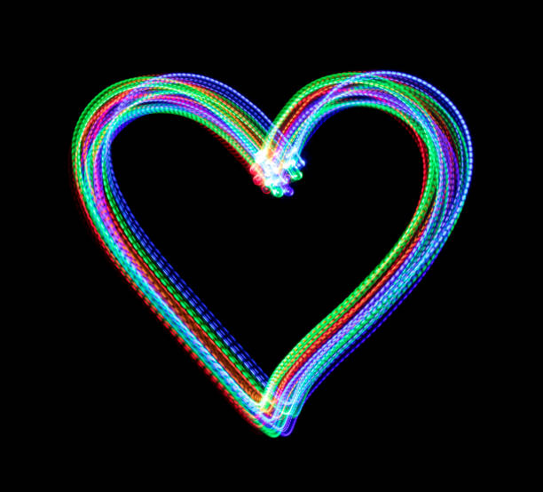 Multi colored heart shape made by LED light painting, isolated on a black background.
